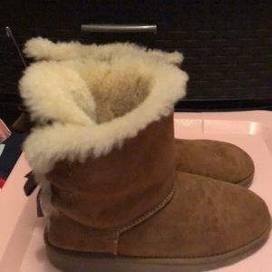 Ugg’s with brown bow ties .